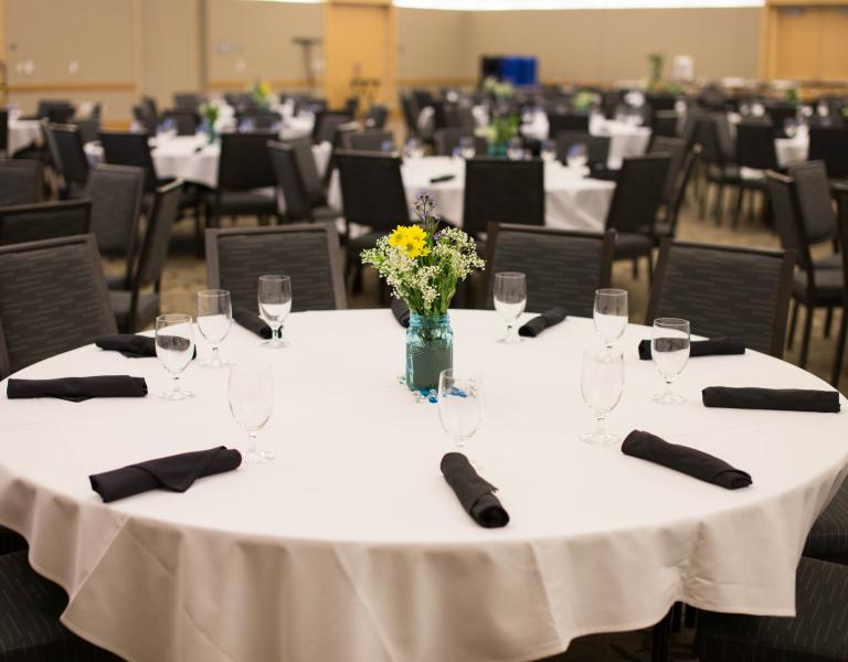Table with linen and flower arrangement