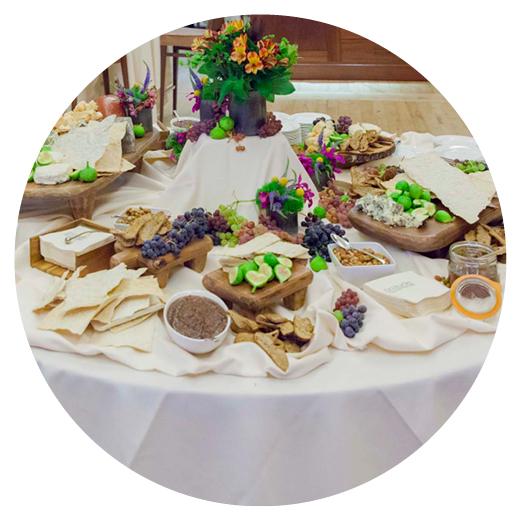 a table laden with cheese and meats