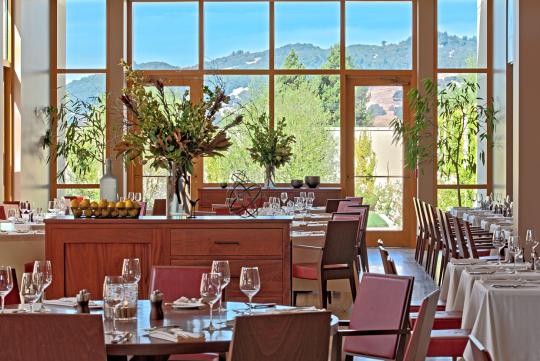 elegant restaurant interior with white table cloths and fireplace