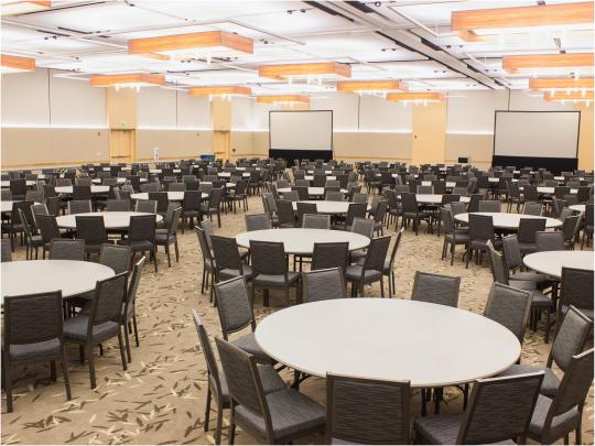 a large conference space interior with round table