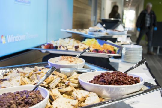 Catering setup of appetizers of bread and olive tapenade 