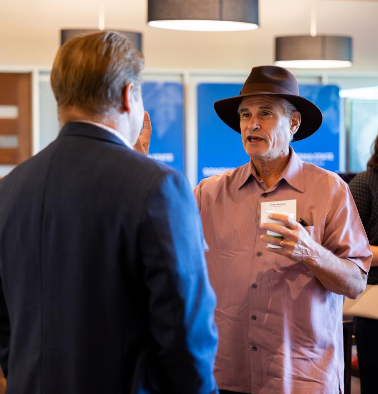 Two people speaking at an event
