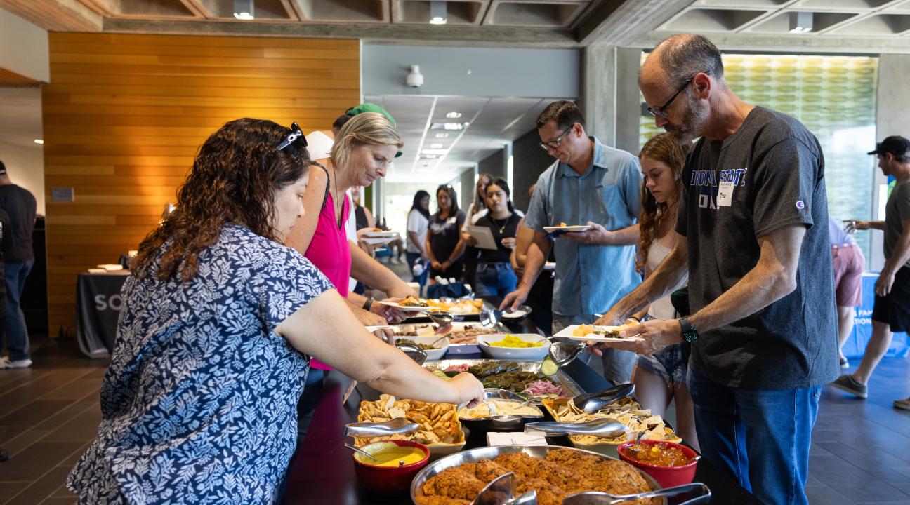 Guests grabbing catered food