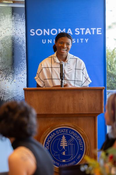 Speaker behind a podium