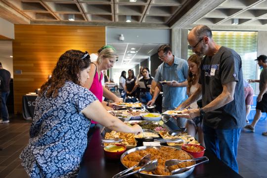 Guests grabbing catered food